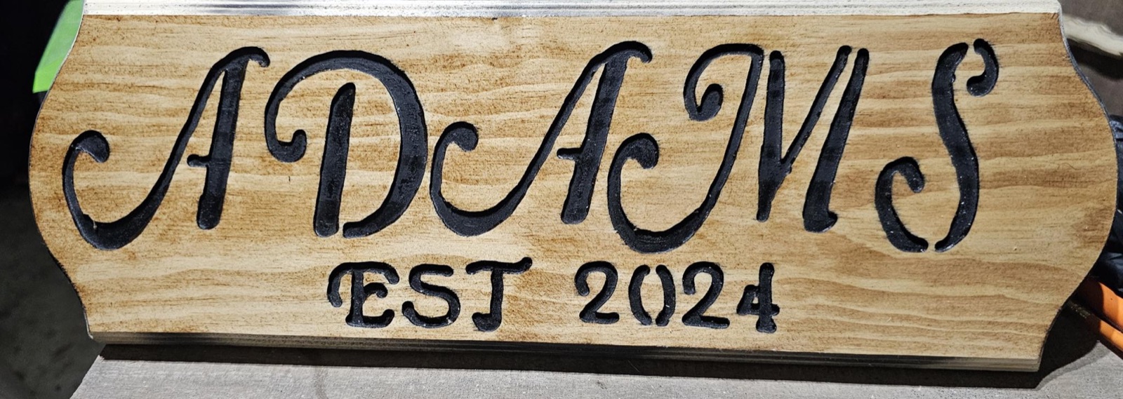Carved family name sign — Adams, Est. 2024