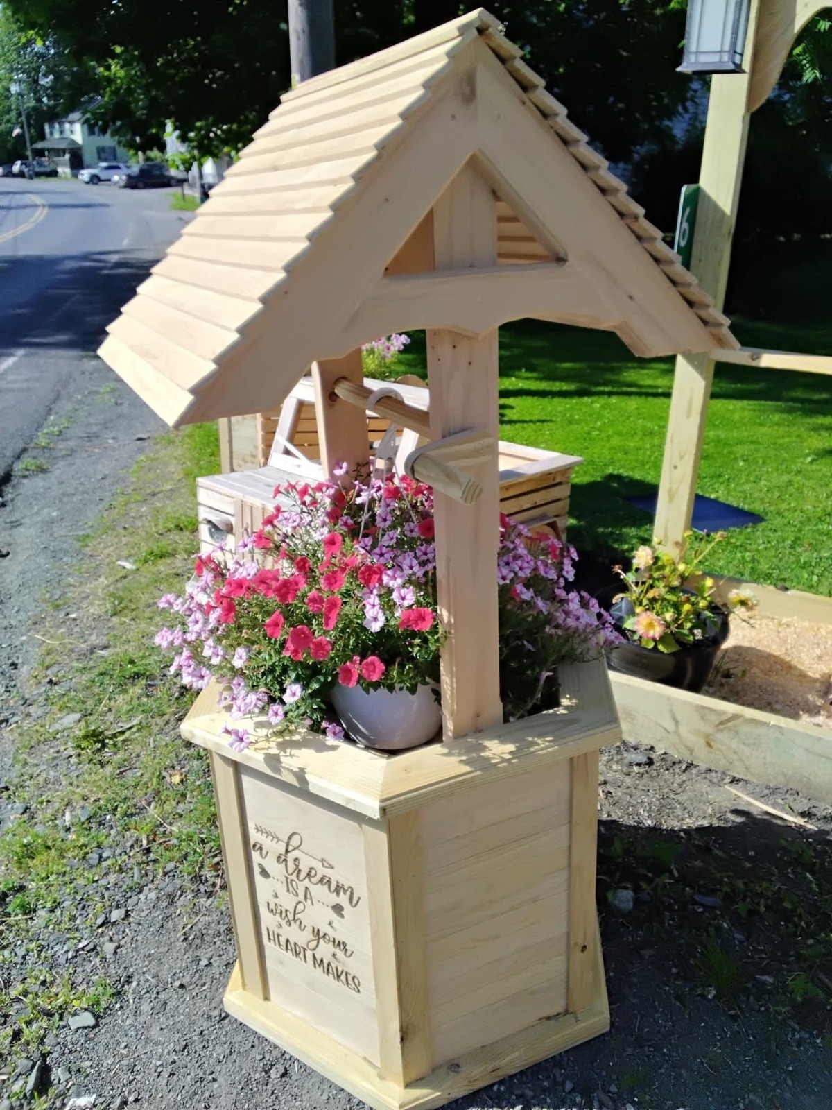 Cedar wishing well planter — “A dream is a wish your heart makes”